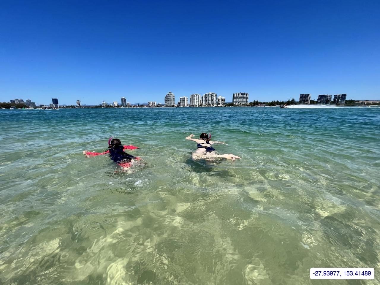 snorkelling with the skyline behind